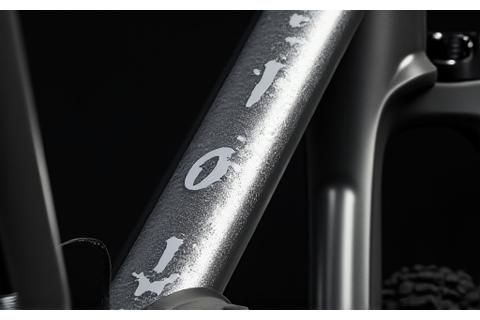 Close-up of a mountain bike frame with a custom topographical map sticker